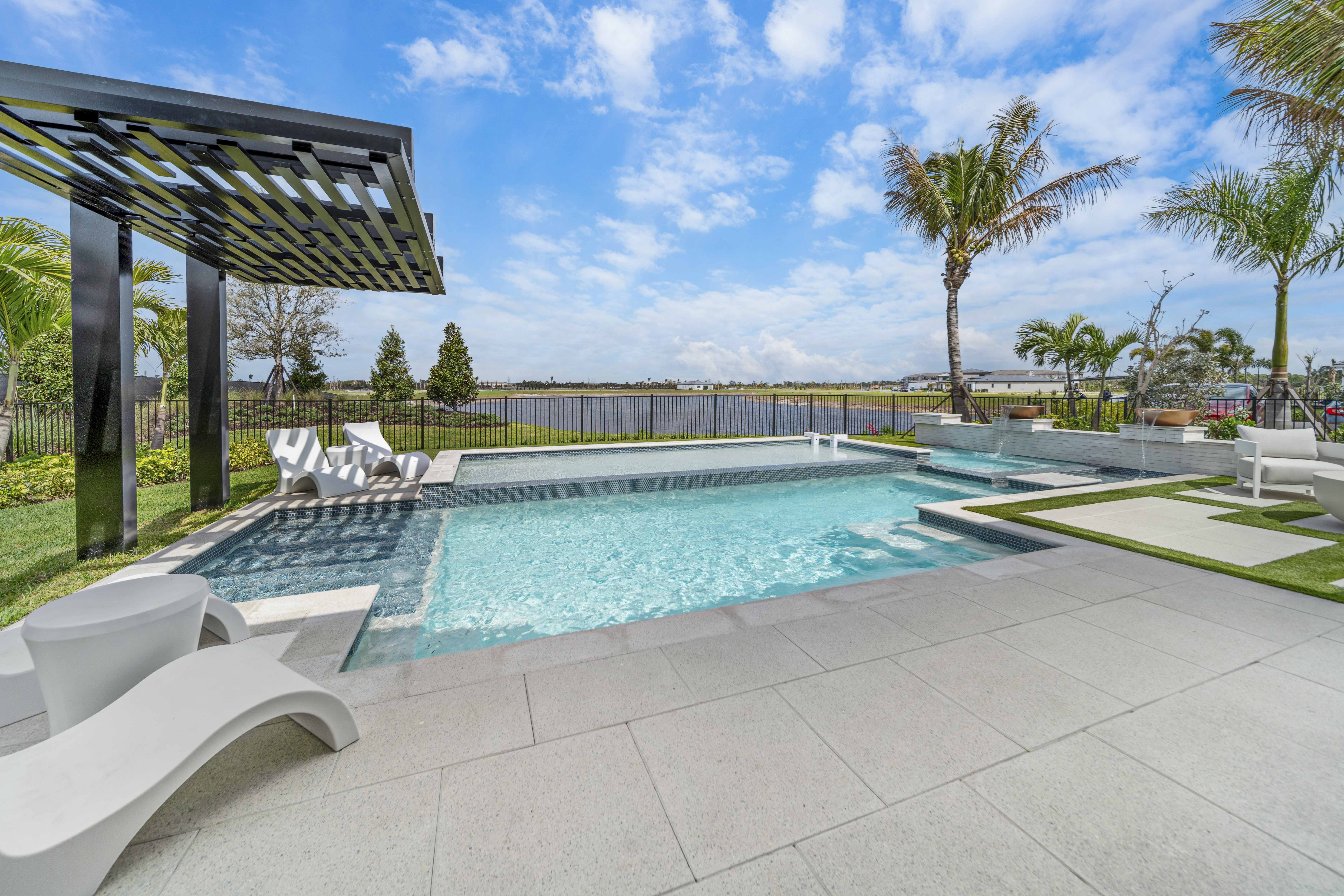 Geometric modern rectangular pool with minimalist stone hardscape and precise edge work at evening - Swim Inc. custom pool Sarasota