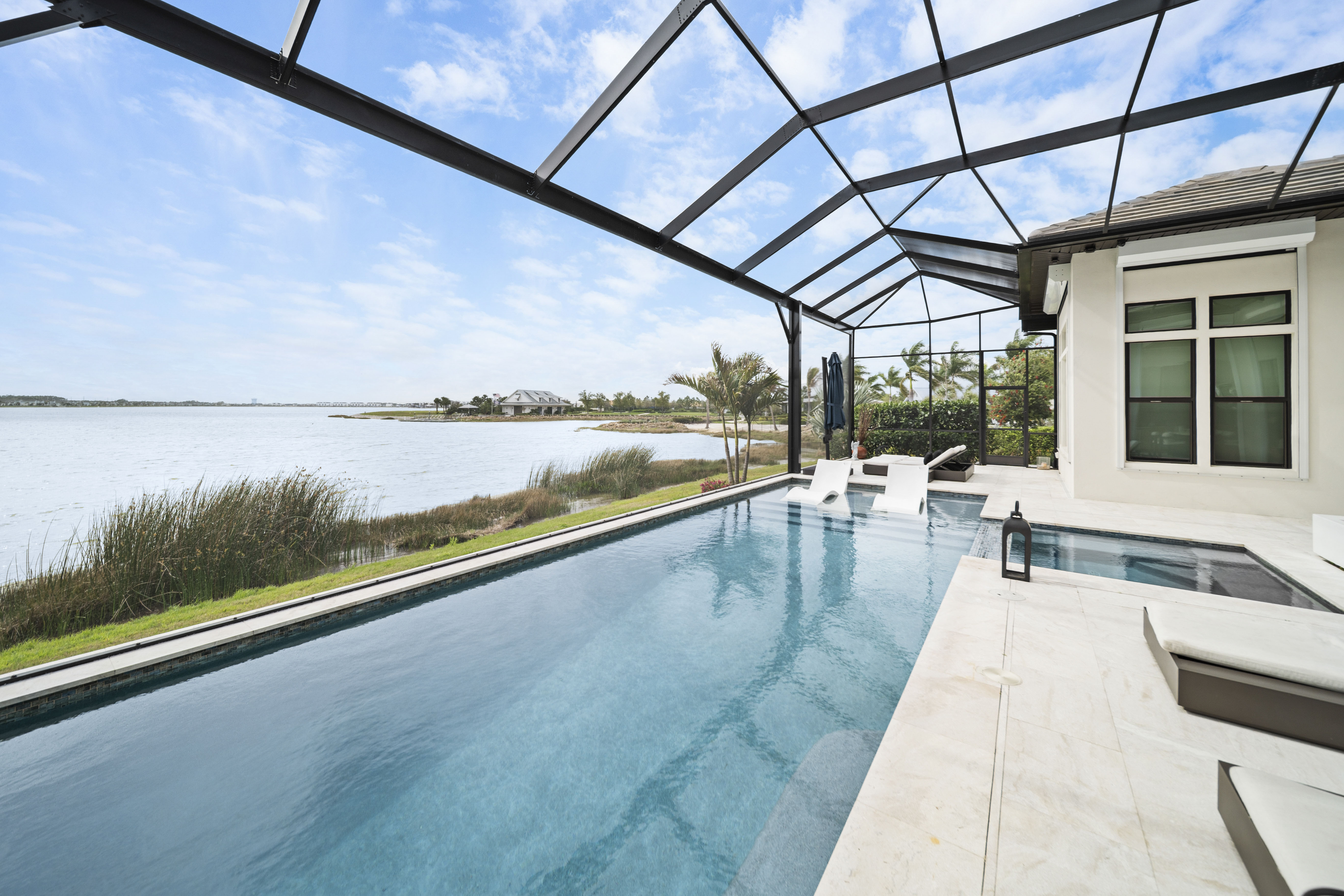 Wide-angle twilight shot of a completed Swim Inc. custom pool with cinematic composition