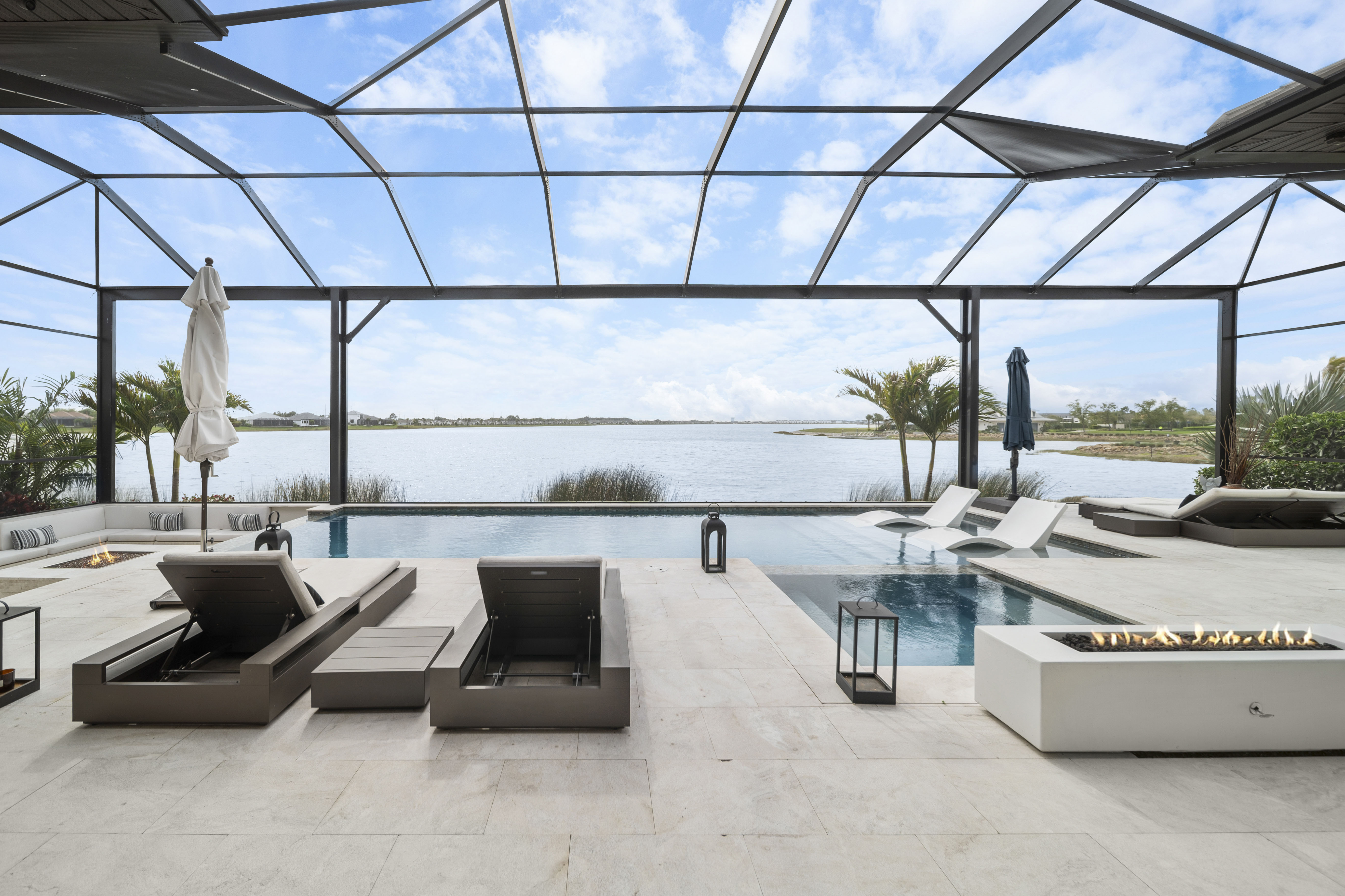Vanishing edge pool with sunken fire pit at Lakewood Ranch, FL by Swim Inc.