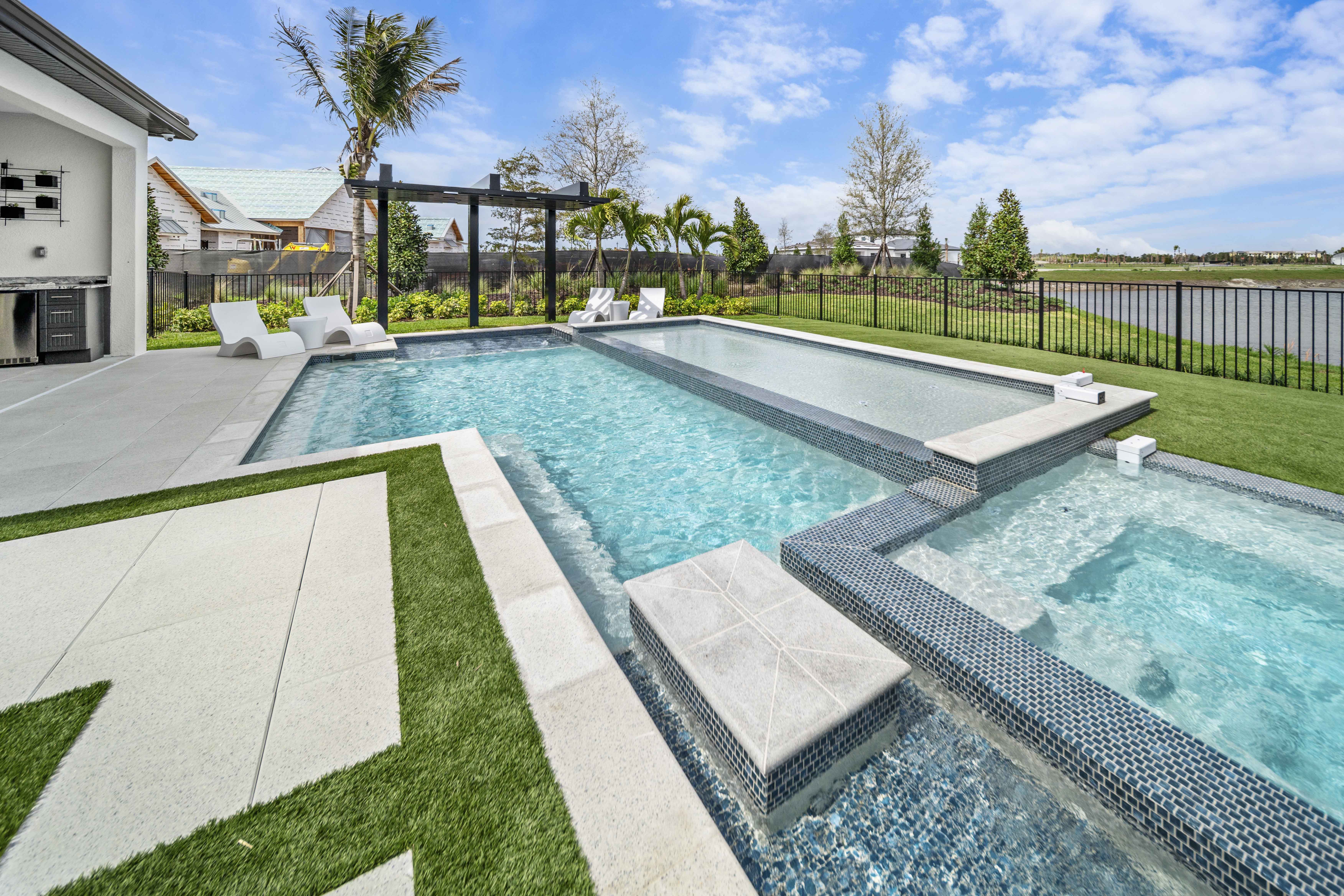 Geometric modern pool full view, square layout with raised sun shelf and spillover spa in Venice, FL, Swim Inc.