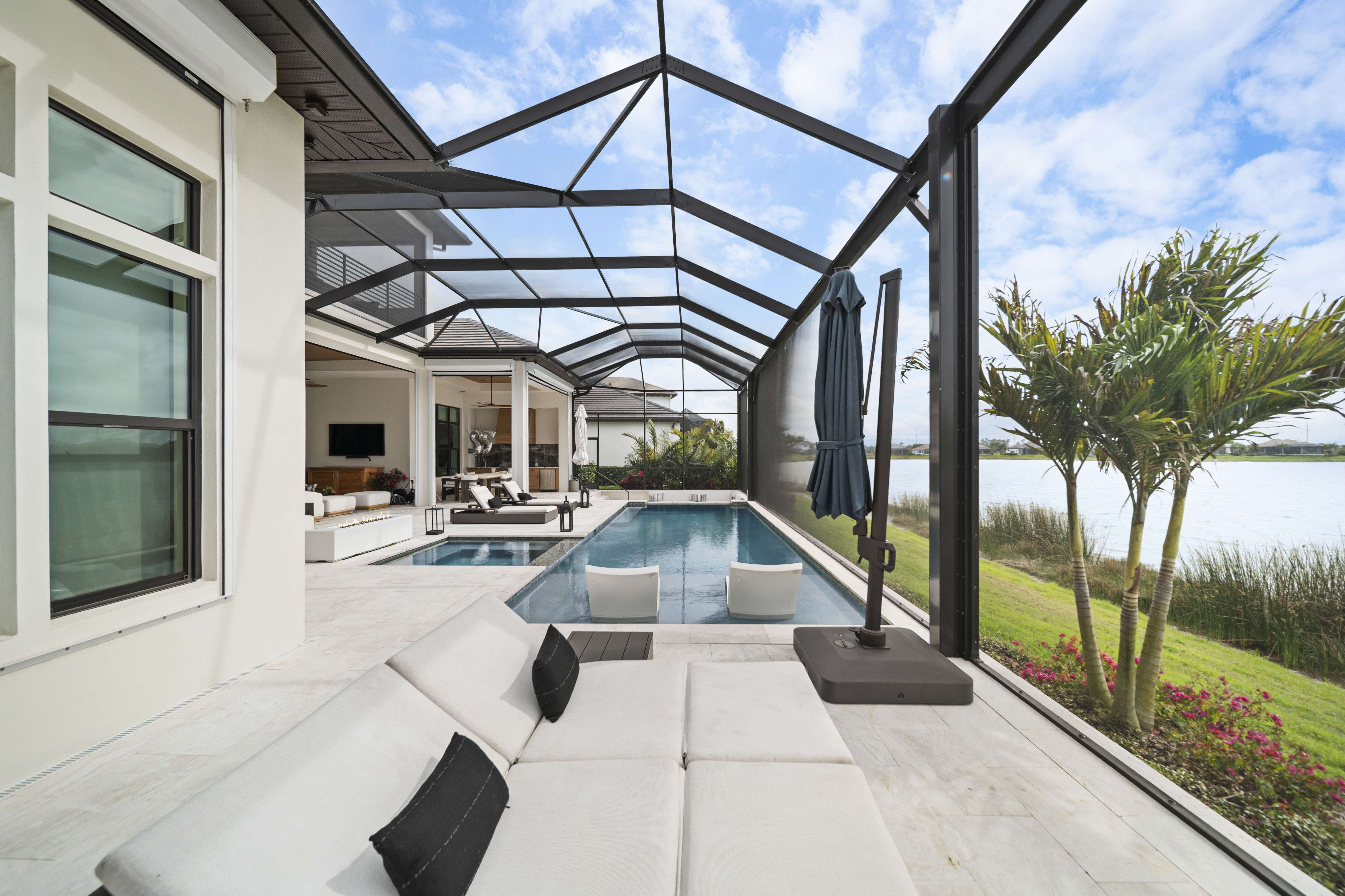 Custom pool design and construction on Siesta Key, FL - Swim Inc. vanishing edge pool on a Gulf-adjacent waterfront property